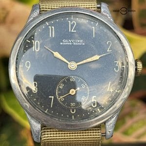 Glycine Bienne Geneve Military Pilot Watch, 37mm black dial, running condition. Buy/sell on Value Your Watch. Timeless design, Swiss craftsmanship.